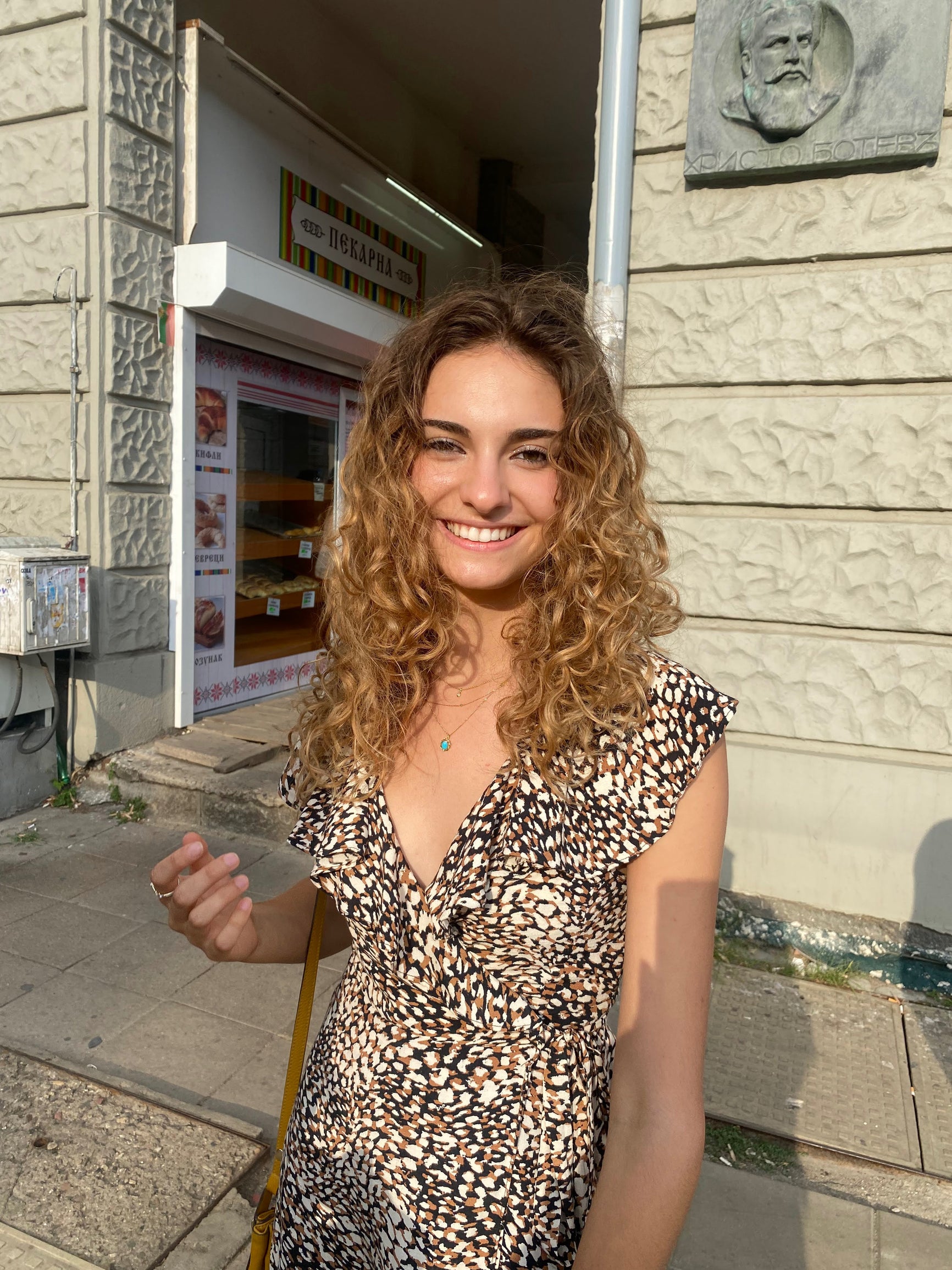 Lili in front of building